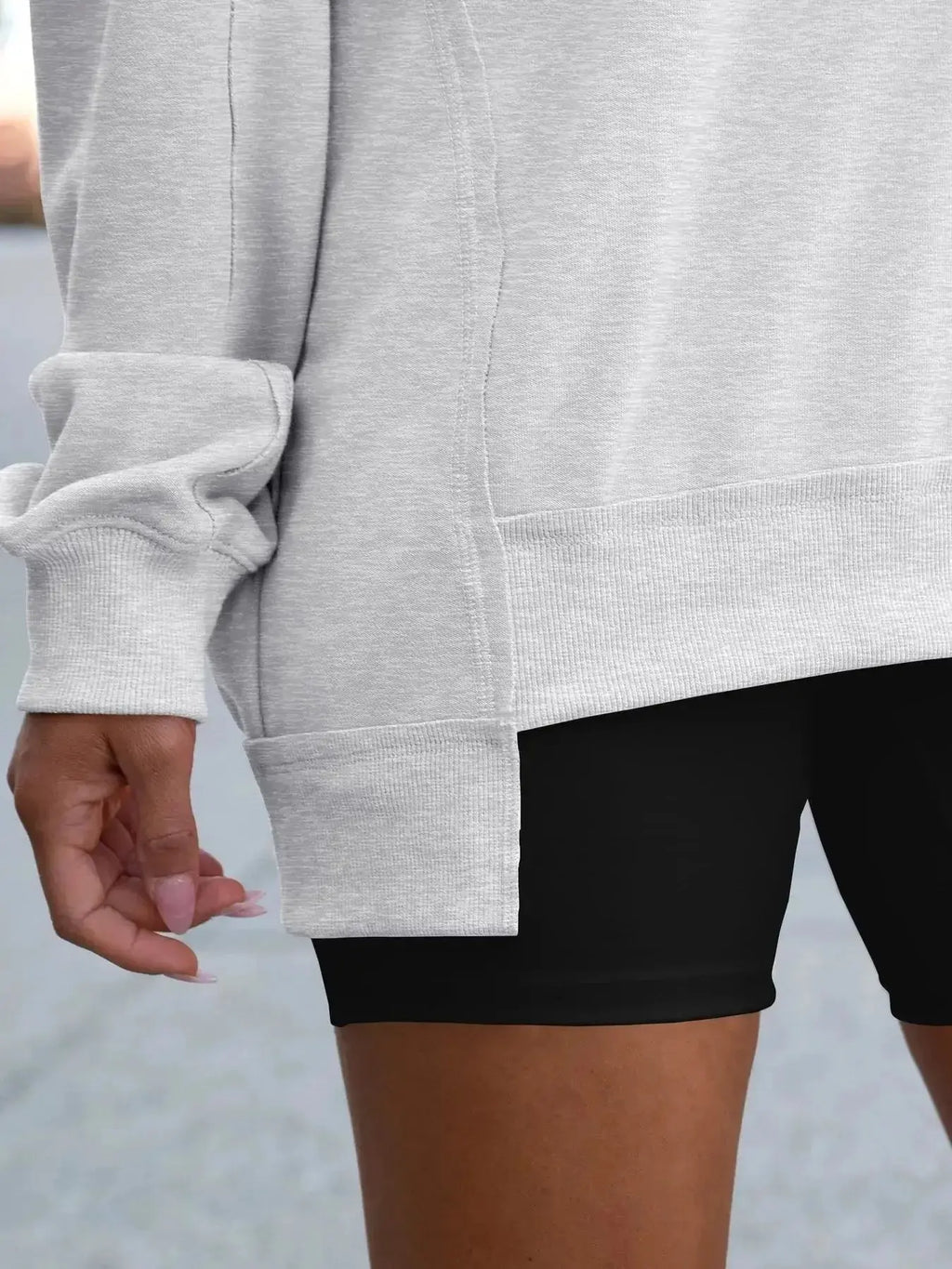 Women’s oversized notched neck sweatshirt with contrast stitching, stylish sweater from Trendsi, featuring a relaxed fit and unique neckline.