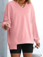 Women’s oversized notched neck sweatshirt with contrast stitching, stylish sweater from Trendsi, featuring a relaxed fit and unique neckline.