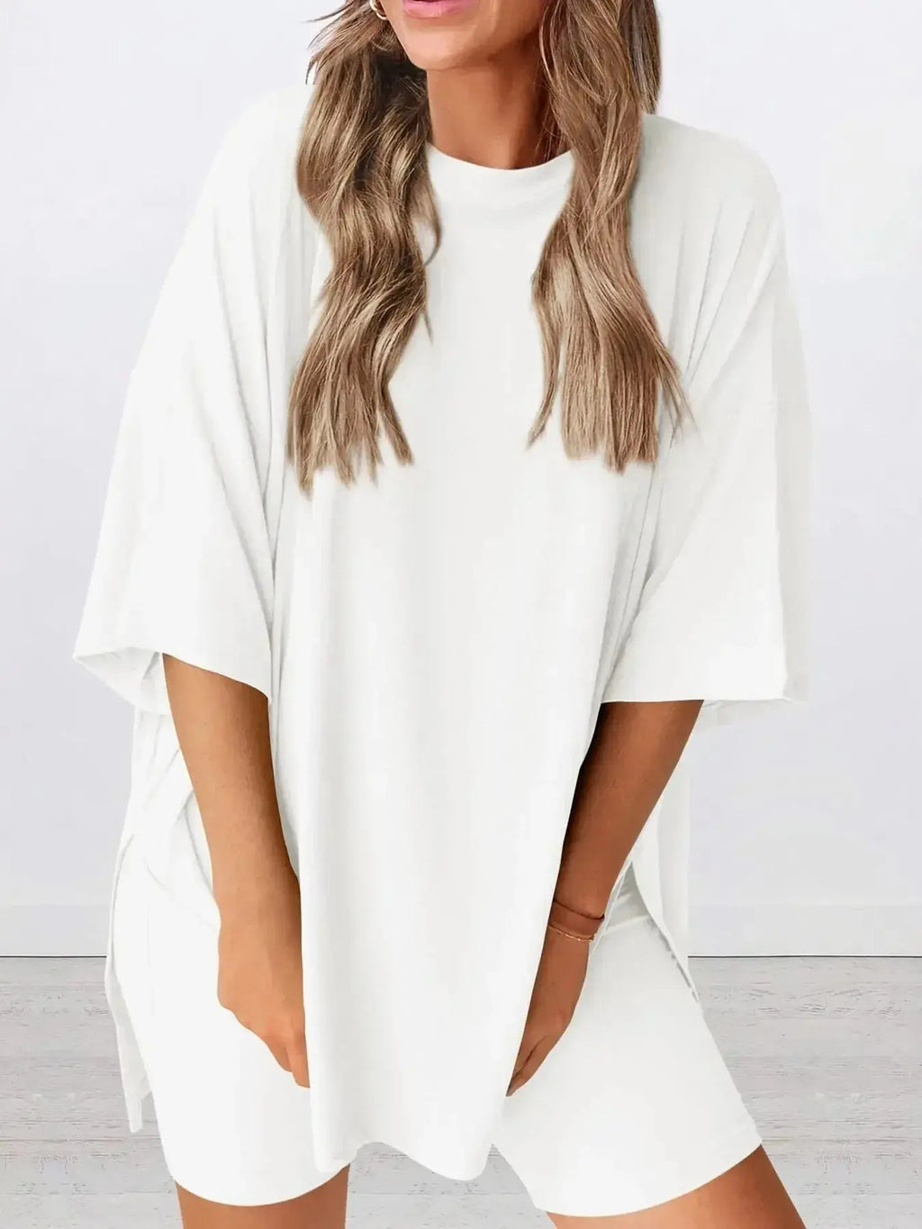 Women's oversized round neck loungewear set by Trendsi, featuring a comfy two-piece shirt and lounge set for relaxed wear.
