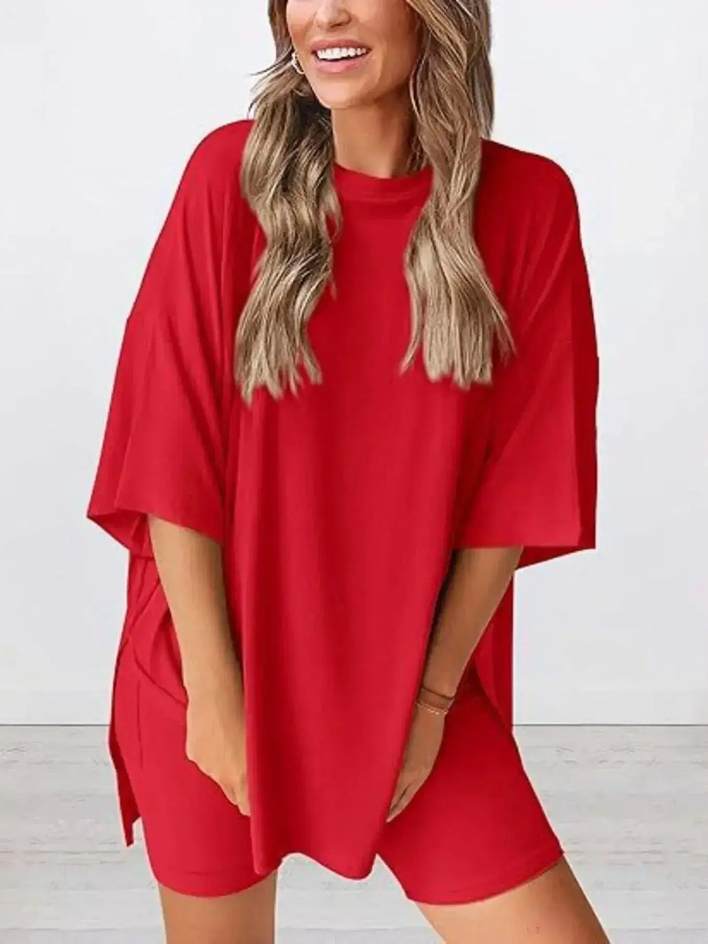 Women’s oversized round neck loungewear set by Trendsi, featuring a comfortable two-piece shirt and lounge pants for relaxed wear.
