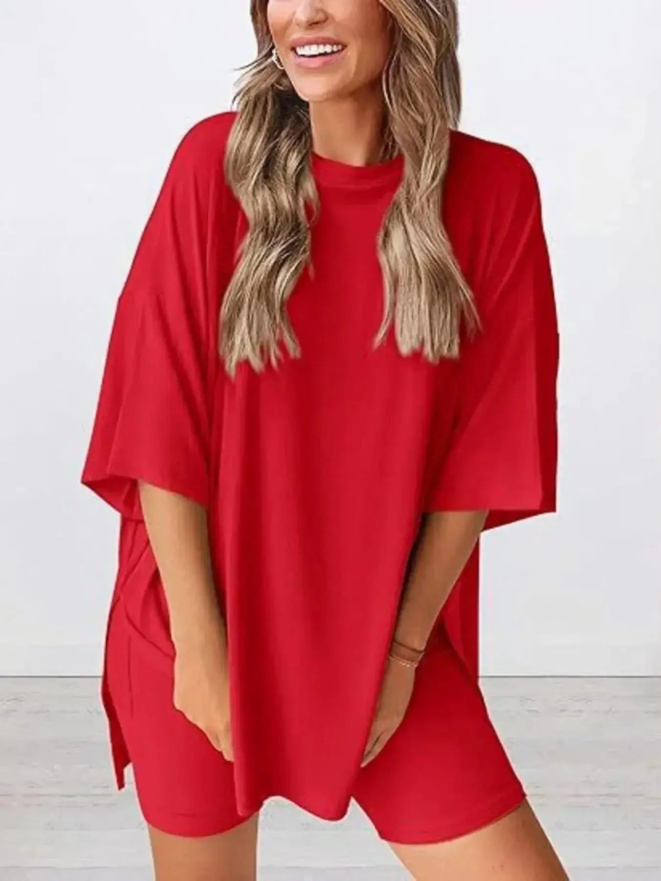 Women’s oversized round neck loungewear set by Trendsi, featuring a comfortable two-piece shirt and lounge pants for relaxed wear.