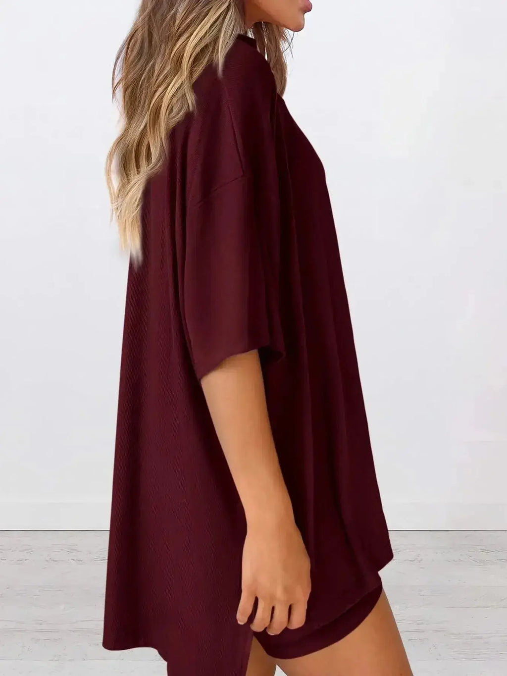 Women’s oversized round neck loungewear shirt from Trendsi, soft and comfortable two-piece lounge set for relaxed wear.