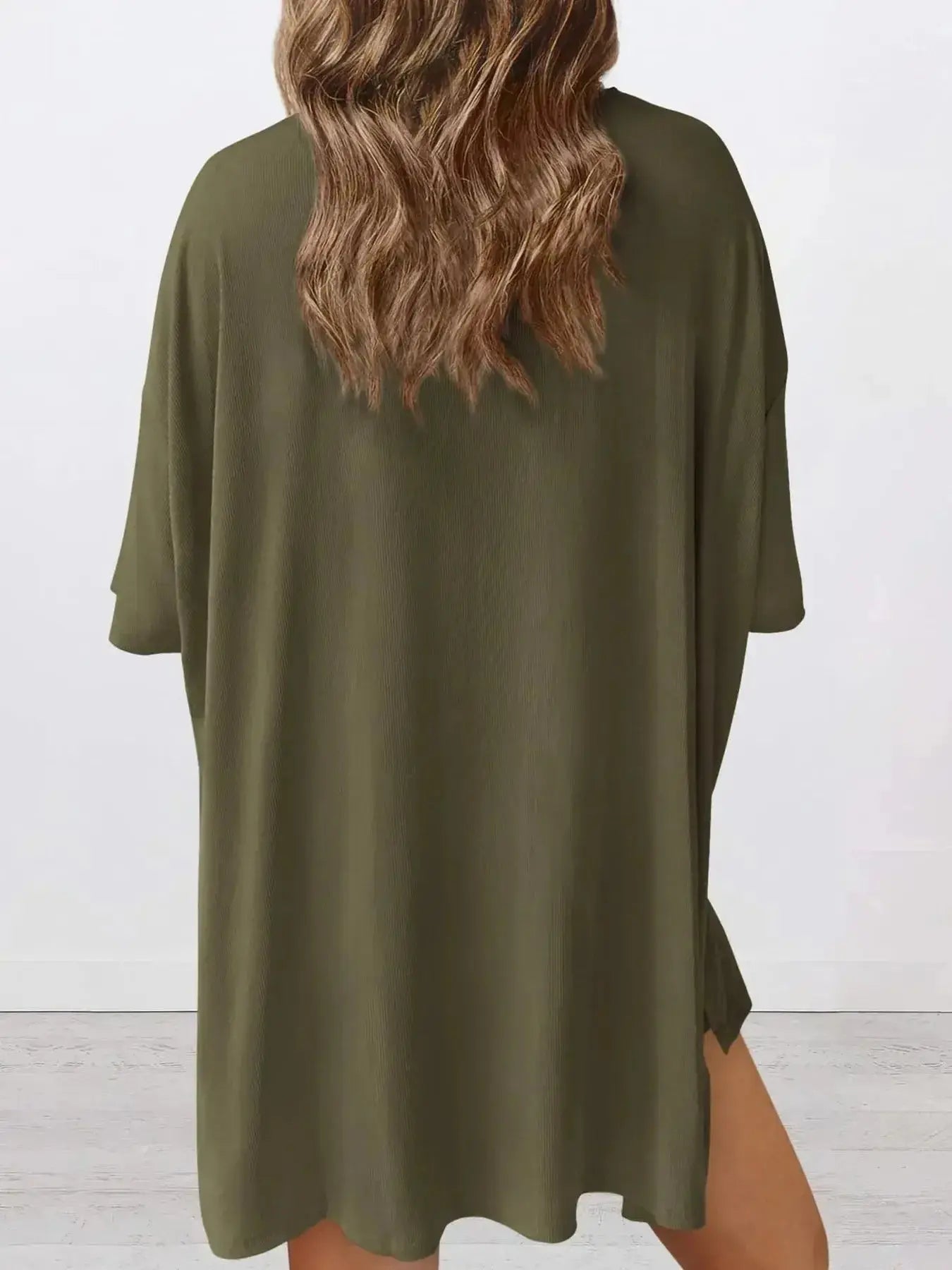 Women's oversized round neck loungewear shirt from Trendsi, part of a cozy two-piece lounge set, in soft, comfortable fabric.