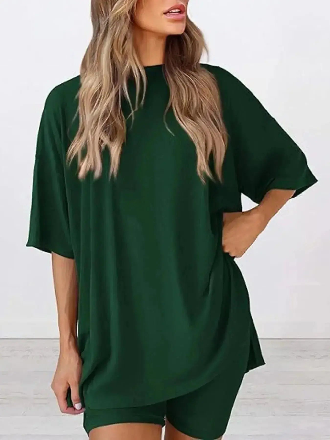 Women's oversized round neck loungewear set by Trendsi, featuring a comfortable two-piece lounge shirt and matching bottom.