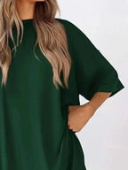 Women’s oversized round neck loungewear set with comfy two-piece shirt and pants by Trendsi, perfect for relaxed indoor wear.