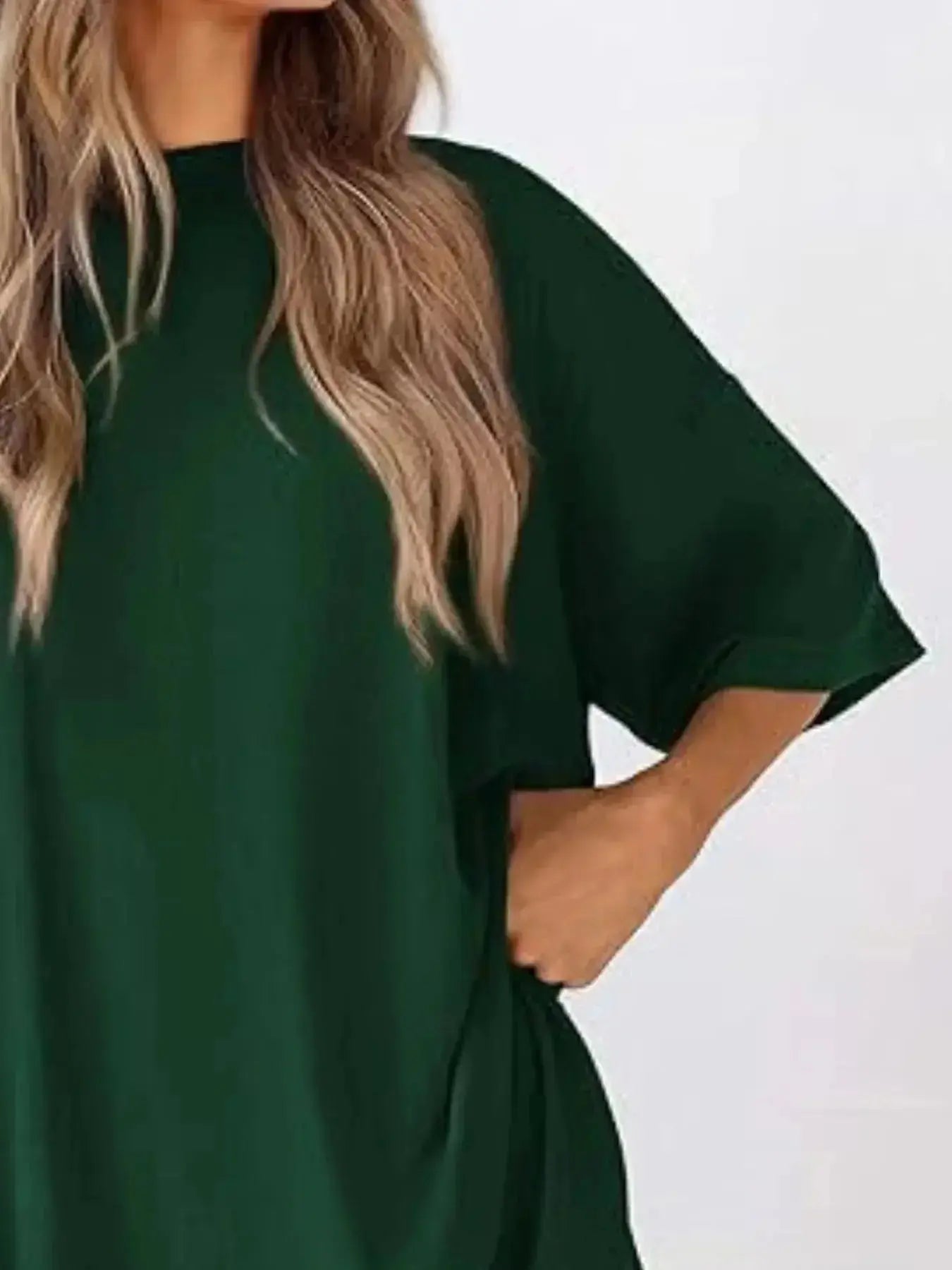 Women’s oversized round neck loungewear set with comfy two-piece shirt and pants by Trendsi, perfect for relaxed indoor wear.