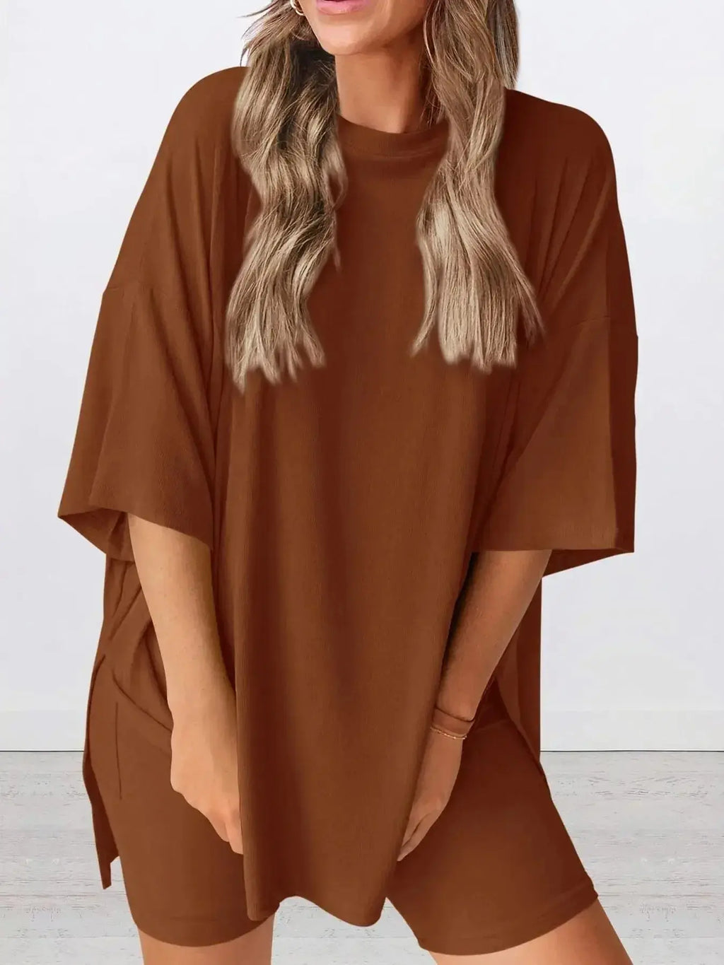 Women's oversized round neck loungewear set by Trendsi, featuring a comfy two-piece shirt and lounge pants for relaxed wear.
