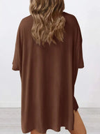 Women's oversized round neck loungewear set by Trendsi, featuring a comfortable two-piece shirt and lounge pants for relaxed wear.