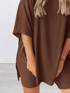 Women’s oversized round neck loungewear set by Trendsi, featuring a comfy two-piece shirt and matching lounge pants.