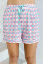 Women's plaid collared short sleeve pajama lounge set with pockets, featuring a comfortable design and stylish pattern.