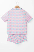Women's plaid collared short sleeve pajama lounge set with pockets, featuring a relaxed fit and cozy fabric from Trendsi.