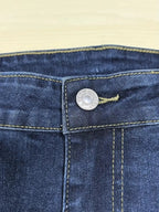 Plus size distressed slim fit jeans with raw hem, women's trendy denim by Trendsi, showcasing fitted style and casual distressed details.