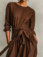 Plus size women's long sleeve maxi dress with tie waist and pockets, stylish and comfortable from Trendsi.