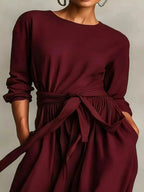 Plus size women's long sleeve maxi dress with tie waist and pockets, stylish and comfortable by Trendsi