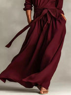 Plus size women's long sleeve maxi dress with tie waist and pockets, stylish and comfortable by Trendsi.