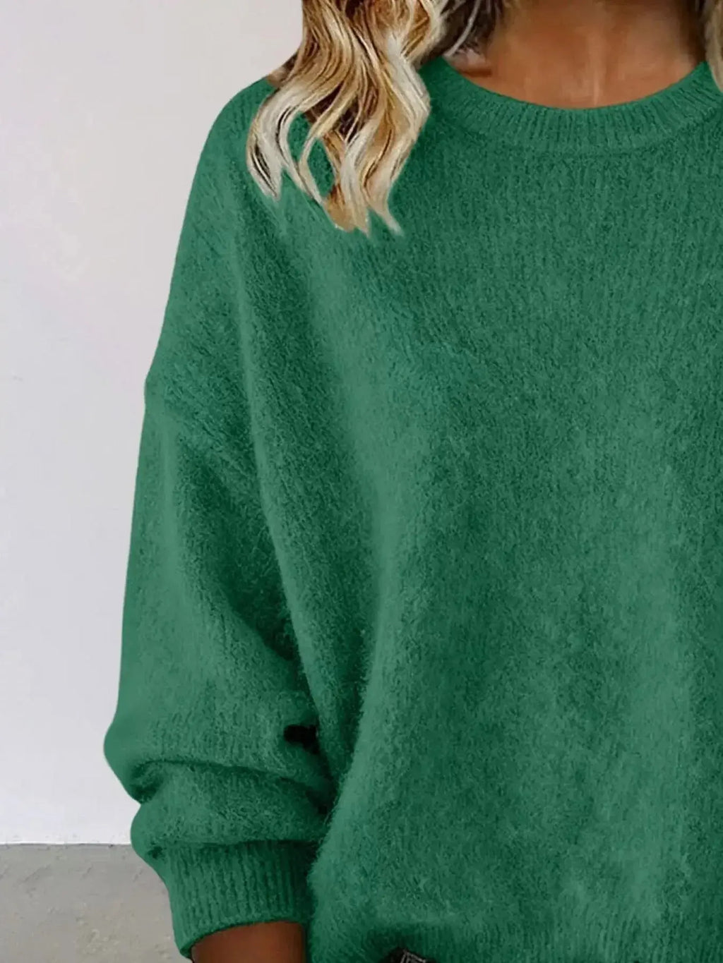 Plus size women's relaxed fit sweater with dropped shoulders and round neck, in soft knit fabric, by Trendsi.