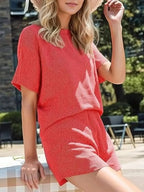 Plus size women's ribbed short sleeve pajama top and shorts lounge set, comfortable sleepwear by Trendsi.