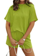 Plus size ribbed short sleeve pajama top and shorts lounge set by Trendsi, comfortable women's sleepwear with a relaxed fit.