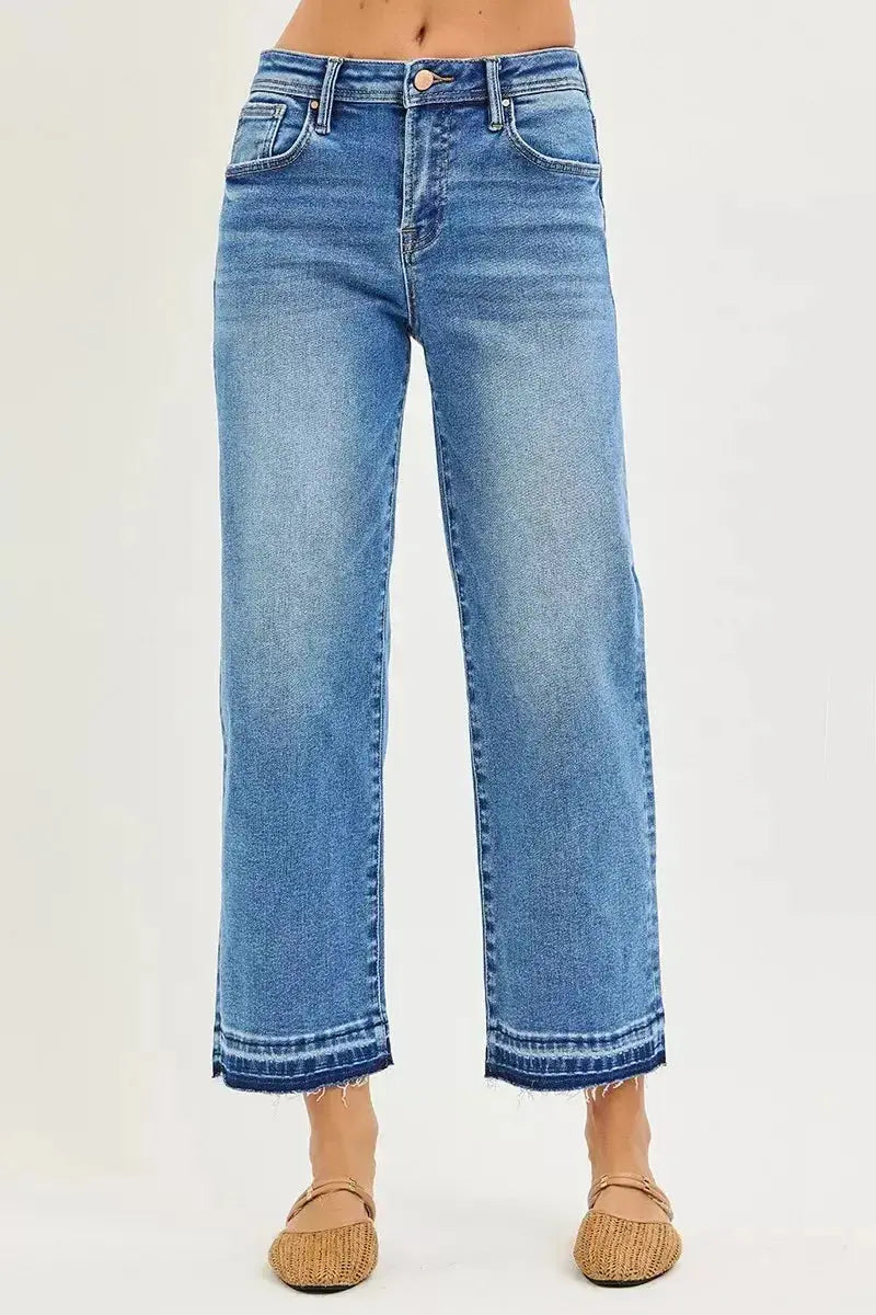 Women’s plus size slouchy cropped boyfriend jeans with distressed details and raw hem from Trendsi, showcasing relaxed denim style.