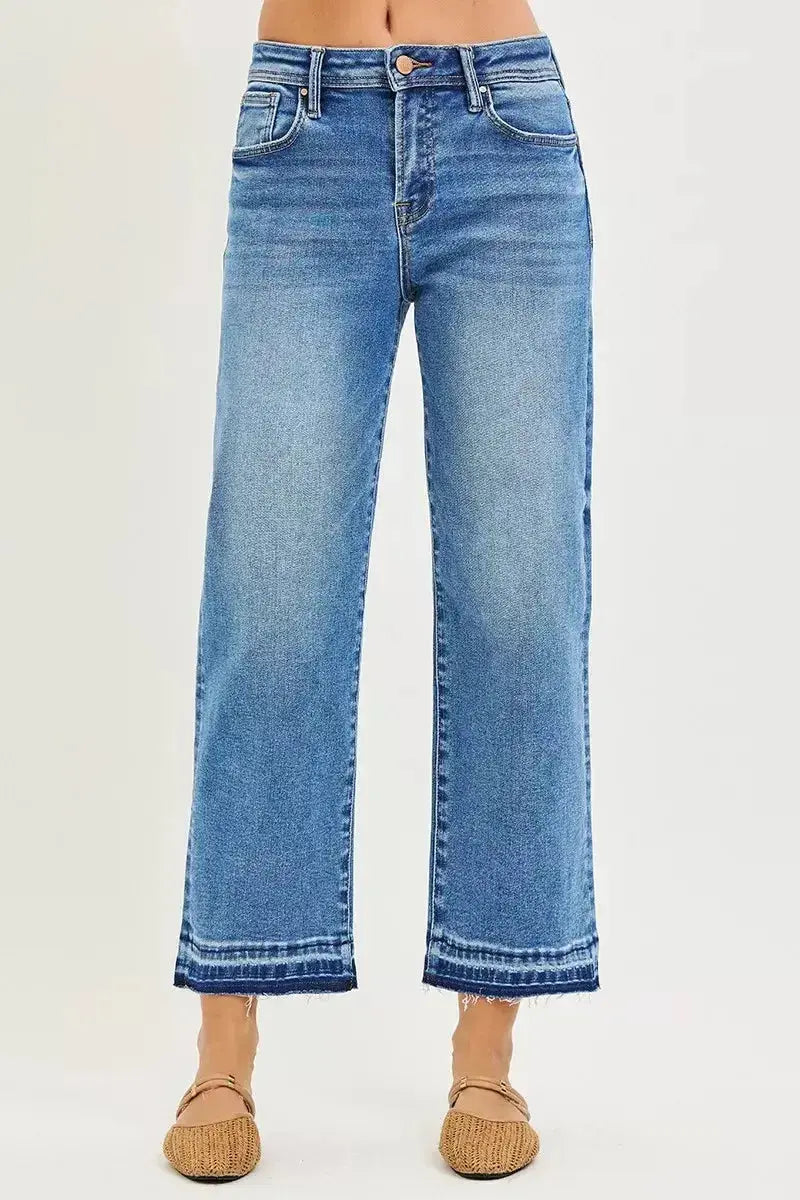 Plus size slouchy cropped boyfriend jeans with distressed details and raw hem, featuring relaxed fit denim from Trendsi.
