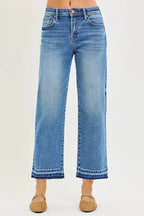 Plus size slouchy cropped boyfriend jeans with distressed details and raw hem, featuring relaxed fit denim from Trendsi.