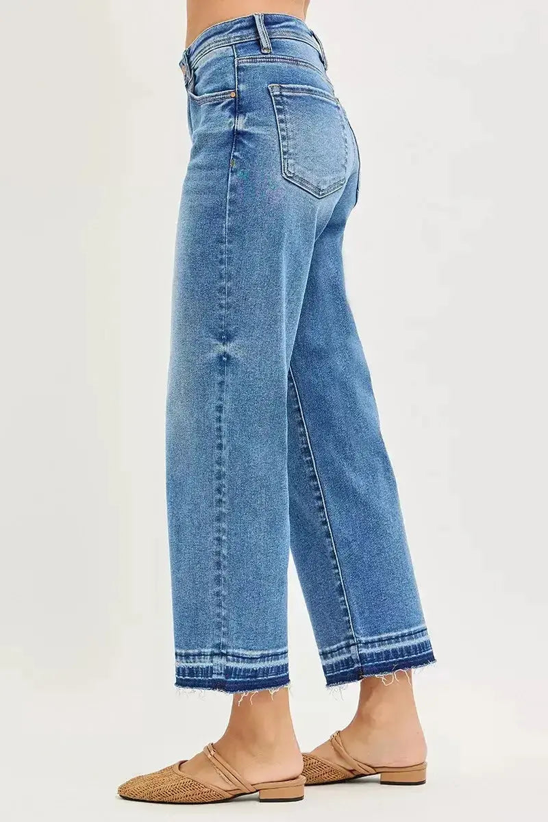 Women’s plus size slouchy cropped boyfriend jeans with distressed details and raw hem, made from denim for a relaxed fit.