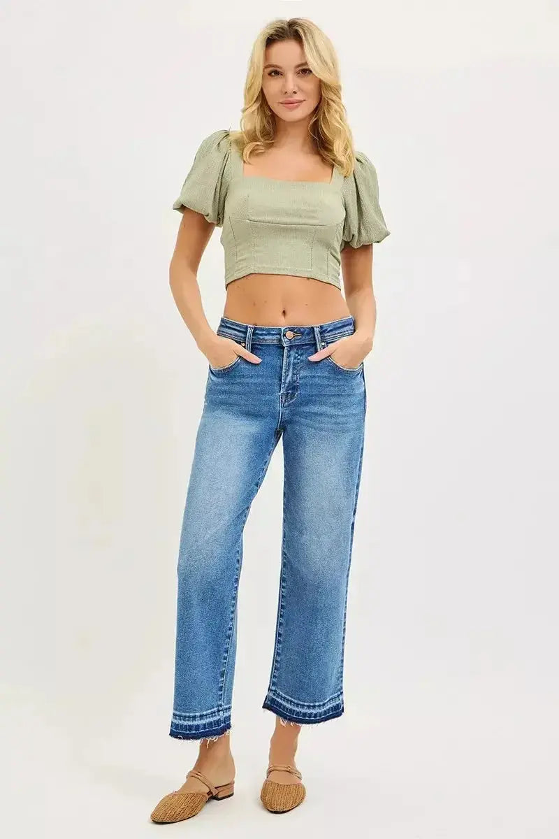 Plus size women's slouchy cropped boyfriend jeans with distressed details and raw hem, casual denim by Trendsi.