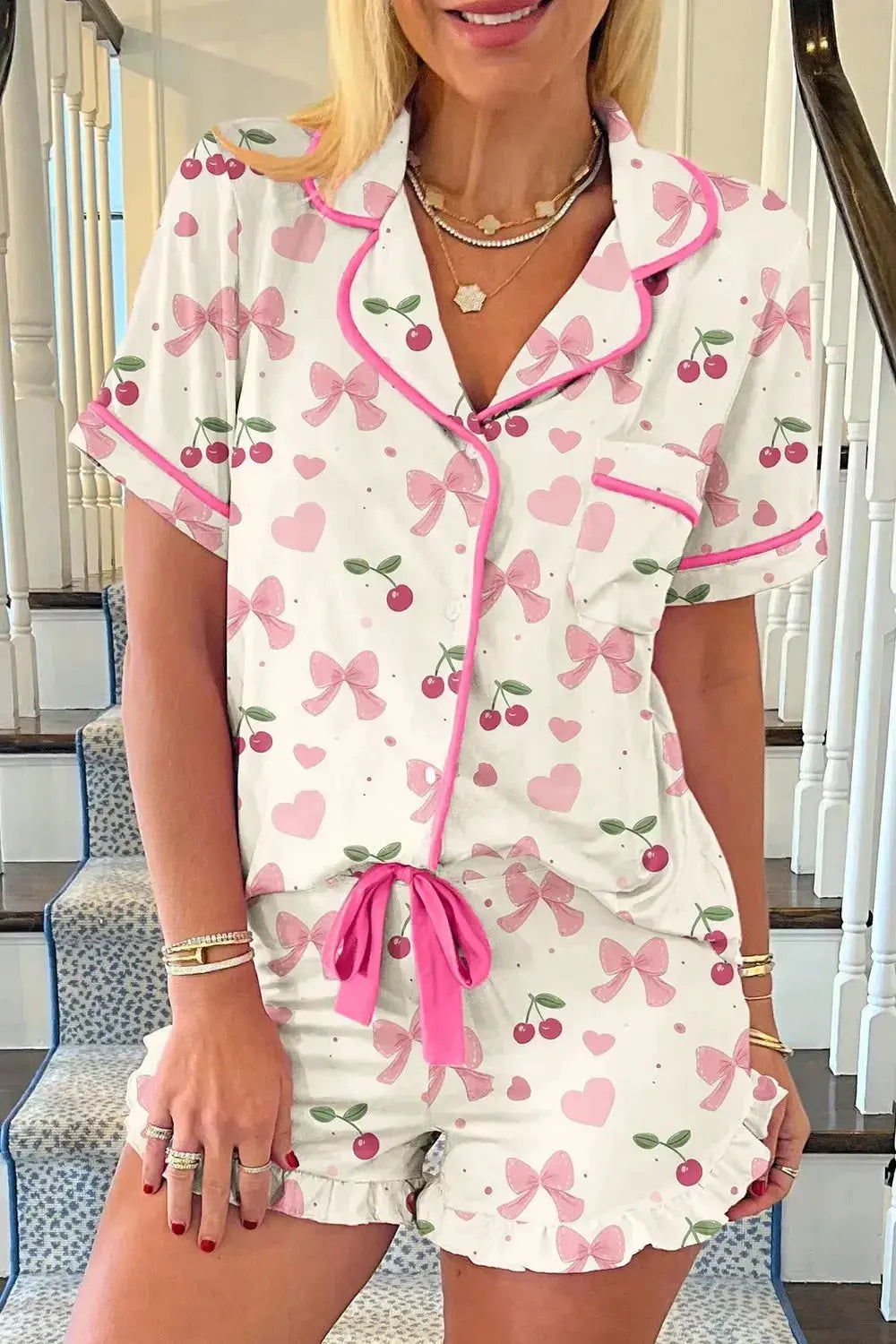 Women's printed button-up short sleeve pajama top and shorts lounge set by Trendsi, featuring a comfortable, stylish sleepwear design.