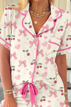 Women’s printed button-up short sleeve pajama top and shorts lounge set by Trendsi, featuring a cozy, stylish sleepwear ensemble.