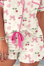 Women's printed button-up short sleeve pajama top and shorts lounge set by Trendsi, featuring a comfortable and stylish sleepwear design.