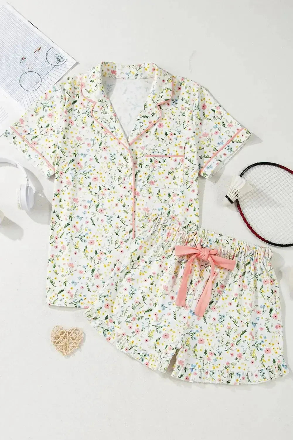 Women's printed button-up short sleeve pajama top and shorts lounge set by Trendsi, featuring a comfortable, stylish sleepwear ensemble.