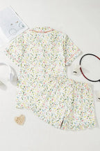 Women’s printed button-up short-sleeve pajama top and shorts lounge set by Trendsi, featuring a comfortable, relaxed fit.