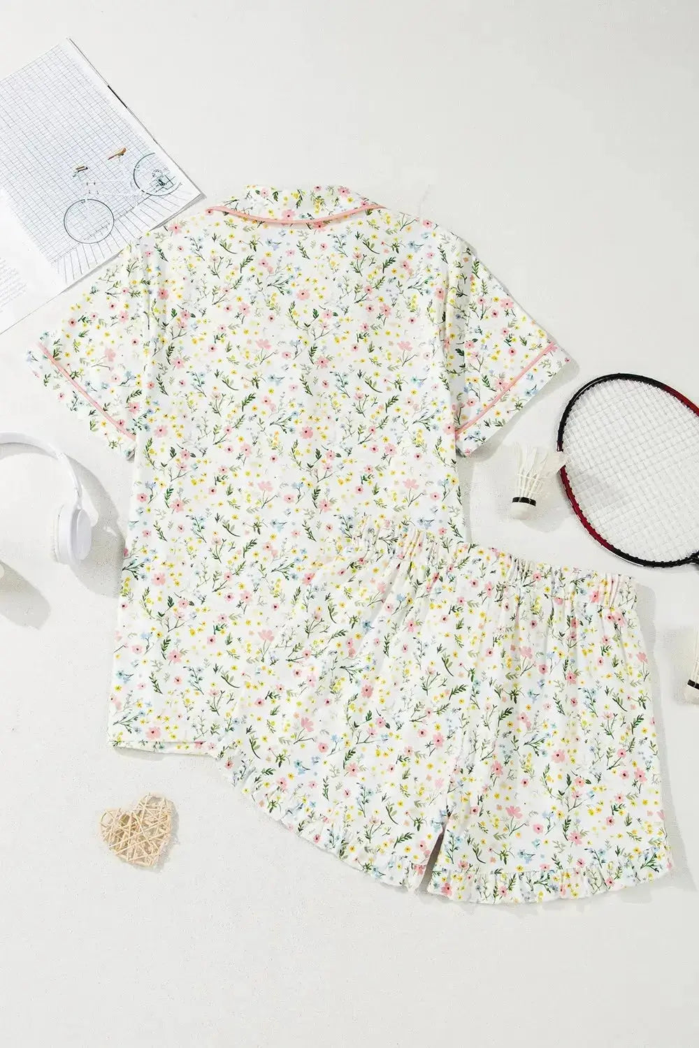 Women’s printed button-up short-sleeve pajama top and shorts lounge set by Trendsi, featuring a comfortable, relaxed fit.