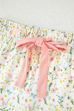 Women’s printed pajama set with button-up short sleeve top and matching shorts, comfortable lounge wear by Trendsi.