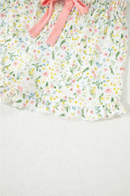 Women's printed button-up short sleeve pajama top and shorts lounge set by Trendsi, featuring a comfortable and stylish sleepwear ensemble.
