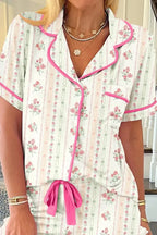 Women's printed button-up short sleeve pajama top and shorts lounge set by Trendsi, featuring a comfortable, casual sleepwear design.