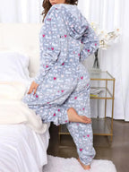 Women’s printed hooded zip-up lounge jumpsuit by Trendsi, cozy one-piece pajamas with a hood and relaxed fit, ideal for lounging.