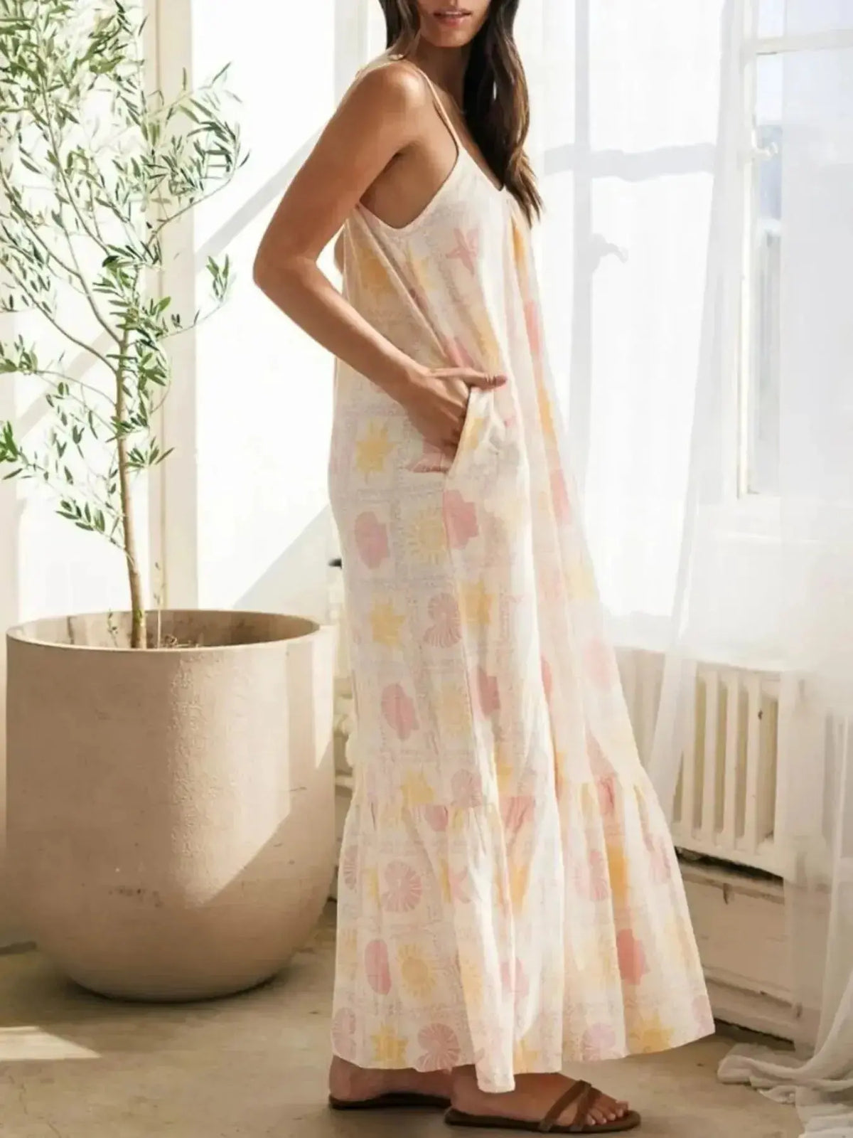 Women's printed maxi lounge dress with ruffled hem and pockets, stylish pajamas by Plush Fashion Hub.