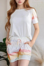 Women's rainbow striped round neck T-shirt and shorts lounge set by Trendsi, casual and comfortable pajama ensemble.