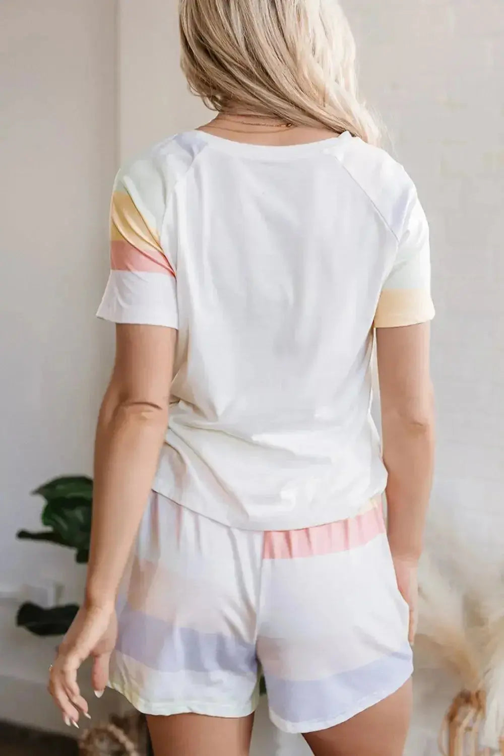 Women’s rainbow striped round neck T-shirt and shorts lounge set by Trendsi, casual and comfortable pajamas for relaxed wear.