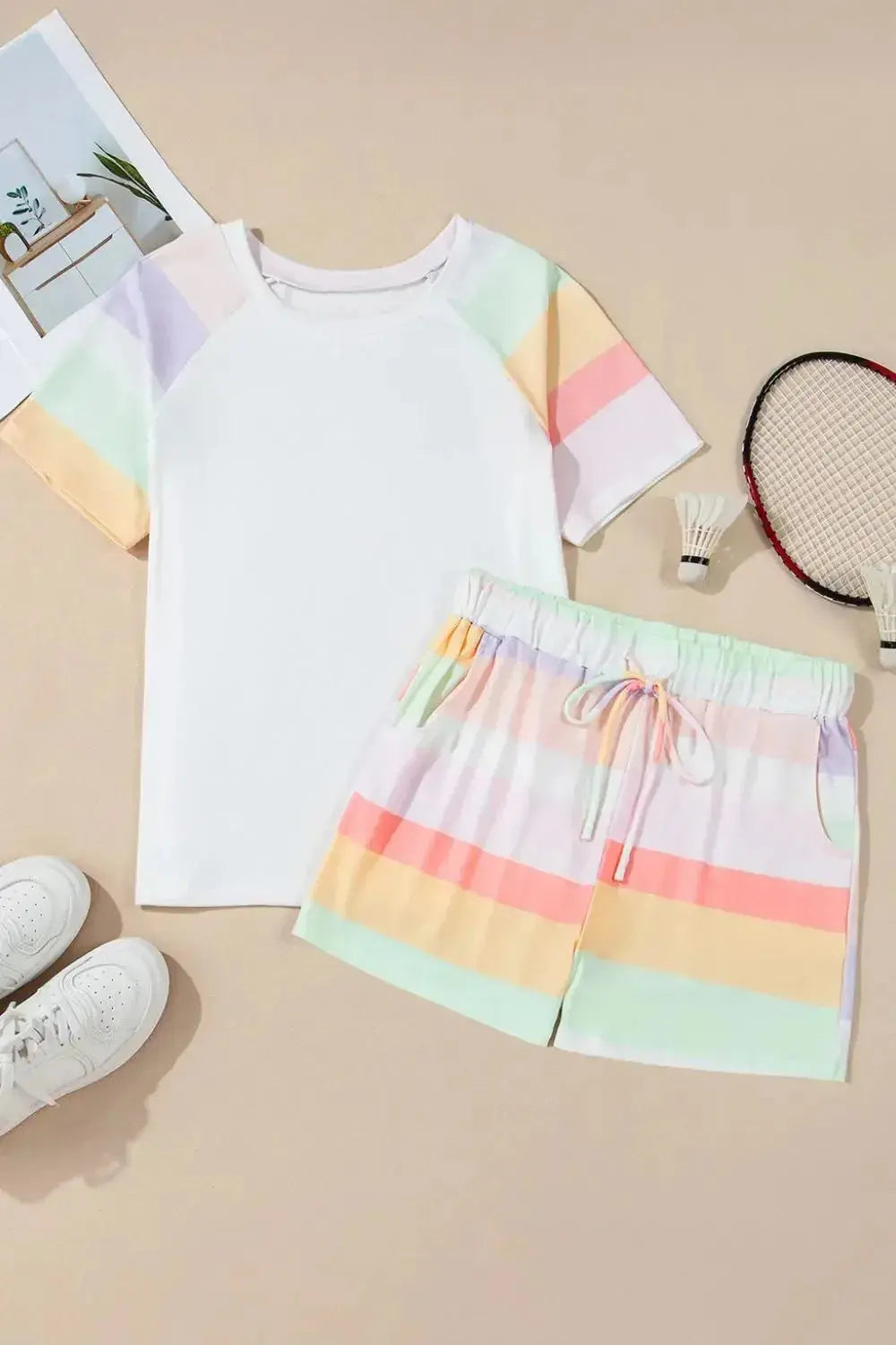 Women’s rainbow striped round neck T-shirt and shorts lounge set by Trendsi, casual pajamas with colorful pattern and comfortable fit.