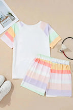Women’s rainbow striped round neck T-shirt and shorts lounge set, soft pajamas from Trendsi, casual and colorful sleepwear.