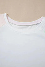 Women’s rainbow striped round neck T-shirt and shorts lounge set, casual pajamas by Trendsi with colorful pattern and comfortable fit.