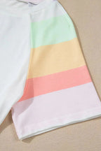 Women's rainbow striped round neck T-shirt and shorts lounge set, casual pajamas by Trendsi, featuring colorful striped fabric.