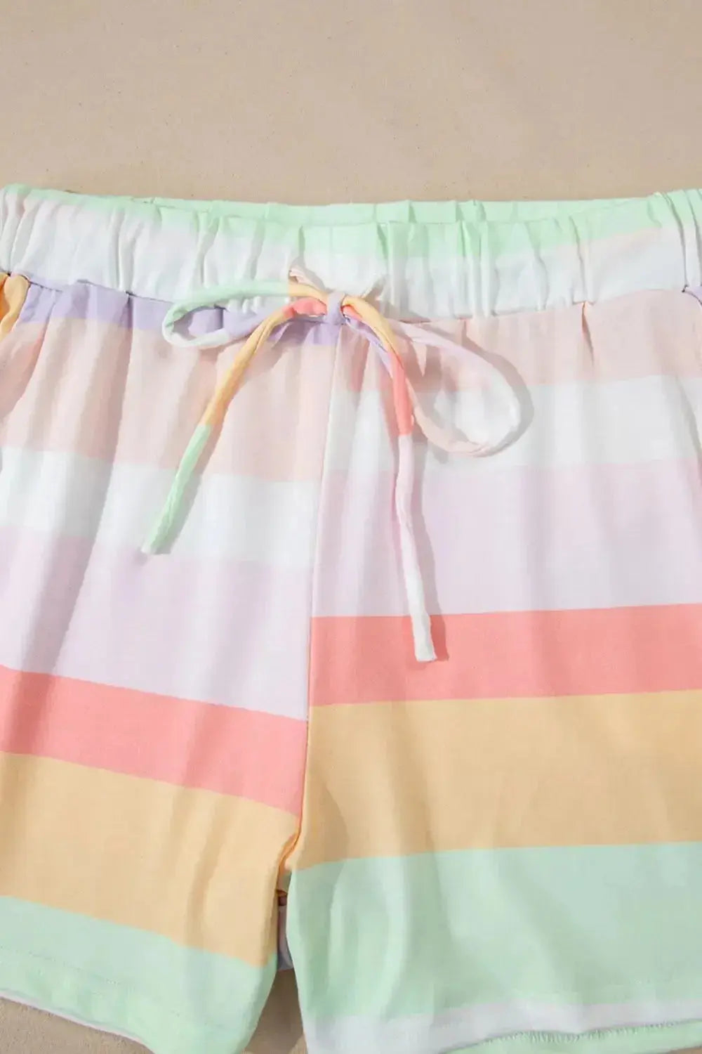 Women's rainbow striped round neck T-shirt and shorts lounge set by Trendsi, casual pajamas with colorful horizontal stripes.