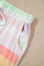 Women’s rainbow striped round neck T-shirt and shorts lounge set, casual pajama set from Trendsi with colorful stripes.