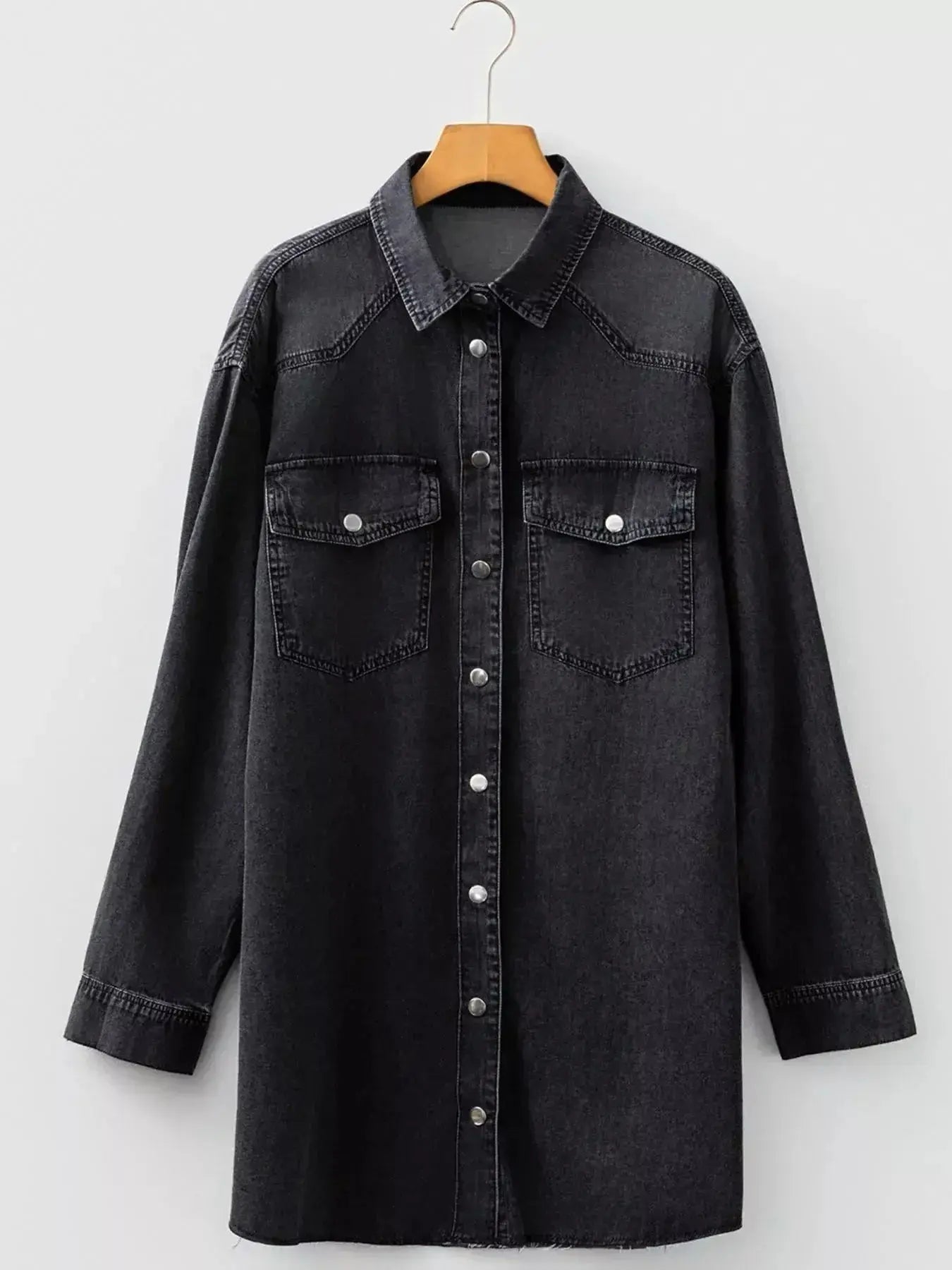 Women’s raw hem denim shirt dress by Trendsi with long sleeves, button-down front, and cotton fabric, styled for casual wear.