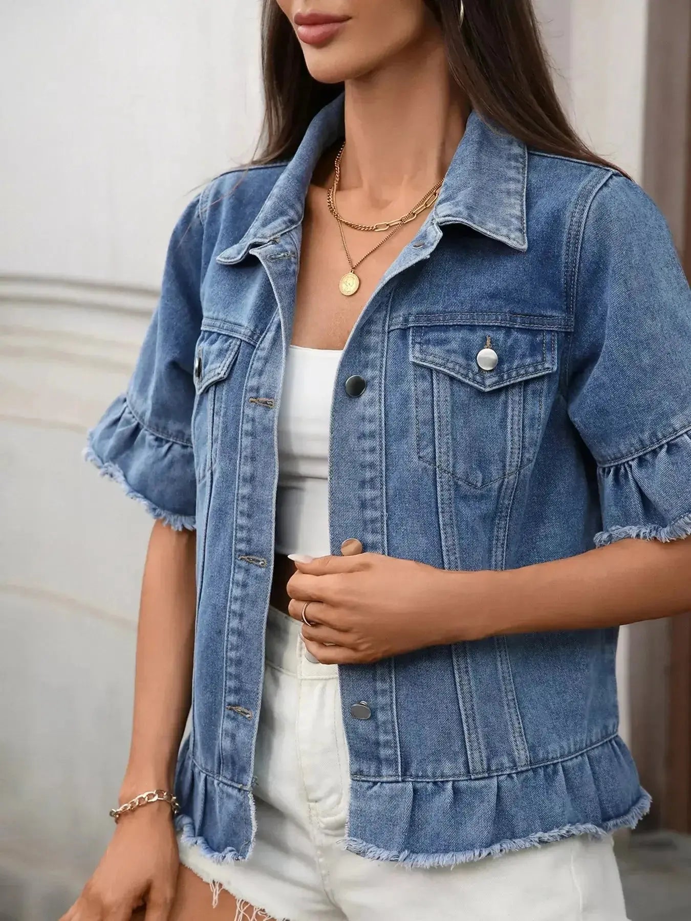Women’s raw hem ruffled denim jacket by Trendsi featuring a stylish button-up design and trendy distressed details.