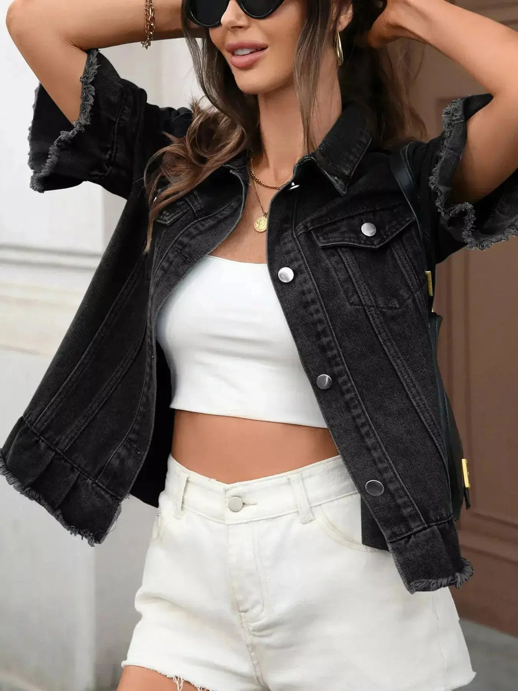 Women's raw hem ruffled denim jacket by Trendsi, stylish button-up jean jacket with ruffle details and distressed hem.