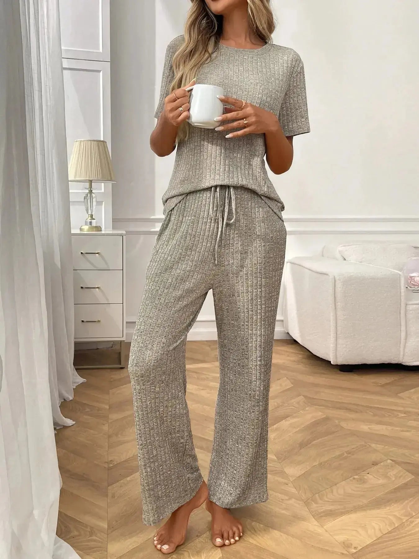 Women’s ribbed knit short sleeve loungewear set with pockets, comfortable pajamas from Trendsi in soft, stretchy fabric.